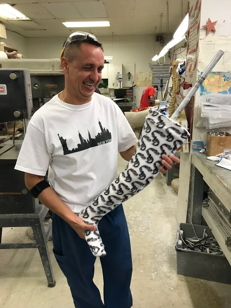 Man carries black and white orthotic transfer